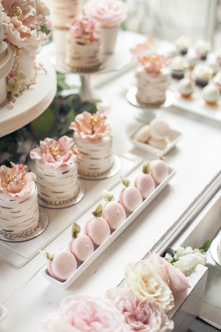 pink Macaorns and mini cakes with intricate details