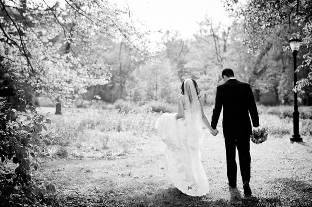 bride and groom walking away together 